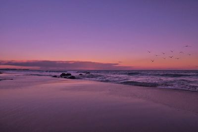 Scenic view of sea at sunset