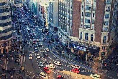 High angle view of traffic on road amidst buildings