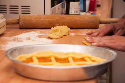 Close-up of person preparing food in kitchen