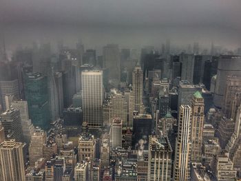 High angle view of buildings in city against sky