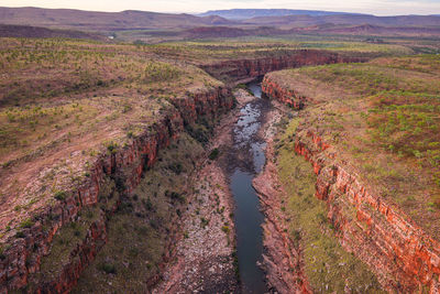 High angle view of river amidst landscape against sky