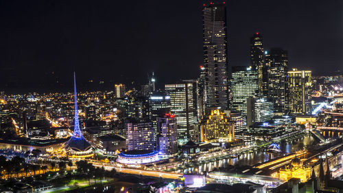 Illuminated buildings in city at night