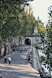 People walking in front of building