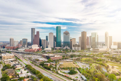 Modern buildings in city against sky