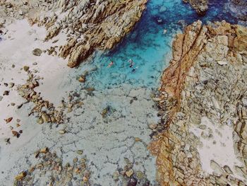 Aerial view of rock formation at beach