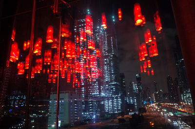 Low angle view of illuminated buildings at night