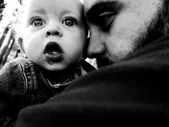 Portrait of father with baby at home