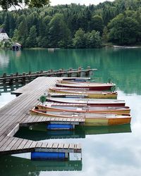 Boats moored in lake