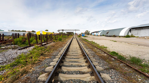 Large plan railroad tracks against the background of a construction site, production workshop