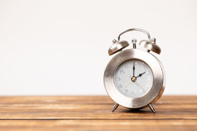 Close-up of clock on table