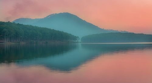 Scenic view of lake against romantic sky