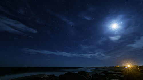 Scenic view of sea against sky at night