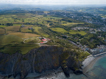 High angle view of land and mountains against sky