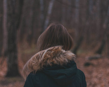 Rear view of woman in forest