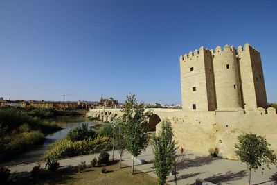 View of castle against clear blue sky