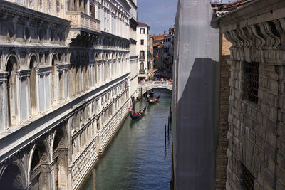 Venice, italy wide angle view of the city of venice, narrow canal and gondola with tourists