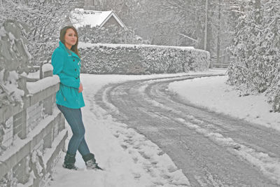 Portrait of a girl standing in snow