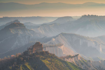 Scenic view of mountains against sky at sunset