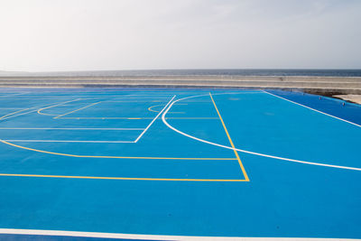 Scenic view of sport field against clear sky