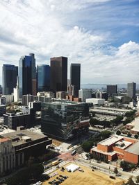 High angle view of city against cloudy sky