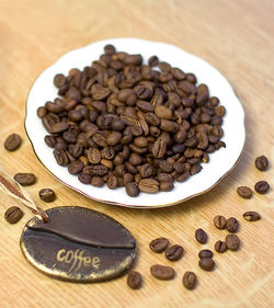 Close-up of coffee beans on table