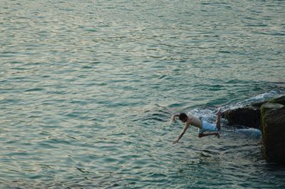 Man swimming in sea