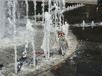 Full length of man splashing water