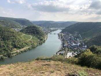 High angle view of townscape by river elbe against sky