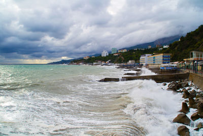 Scenic view of sea against cloudy sky