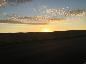 Scenic view of landscape against sky during sunset