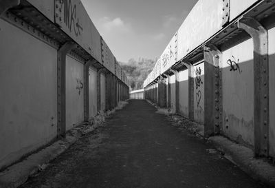 Empty walkway leading to building