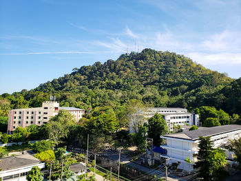 High angle view of trees and buildings against sky