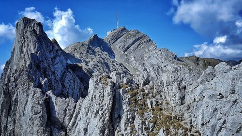 Low angle view of rocky mountains against sky