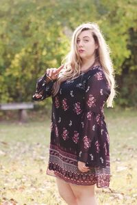 Portrait of woman standing in park