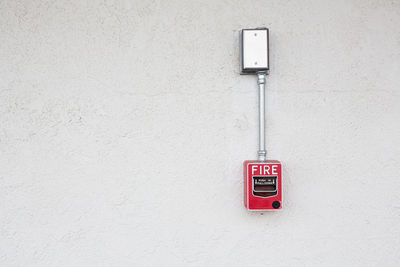 Close-up of electric lamp on wall