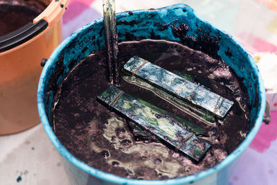 High angle view of paintbrushes in container