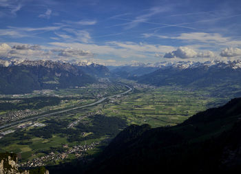 Aerial view of valley and mountains against sky