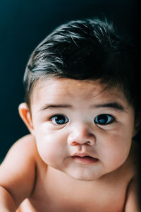 Close-up portrait of cute shirtless baby boy