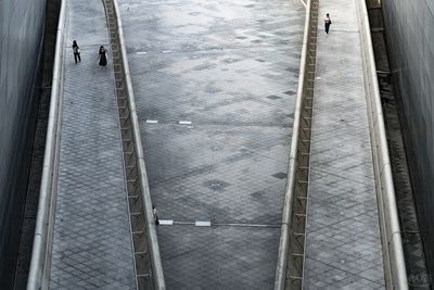 High angle view of people walking on staircase