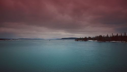 Scenic view of sea against dramatic sky