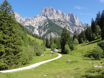 Scenic view of landscape and mountains against sky