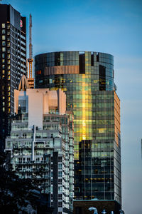 Modern buildings against sky in city