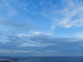 Scenic view of sea against blue sky