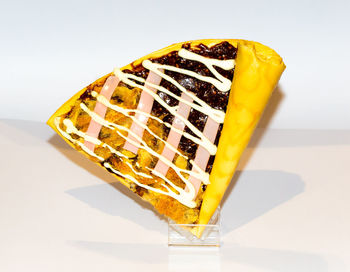 High angle view of dessert on table against white background