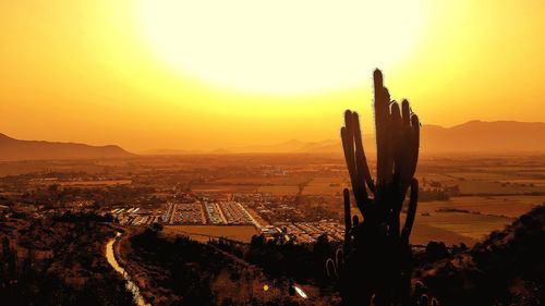 Scenic view of sunset over city