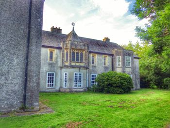 View of lawn with buildings in background