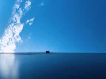 Scenic view of sea against blue sky