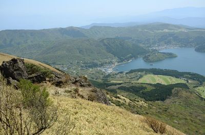 Scenic view of landscape and mountains against sky