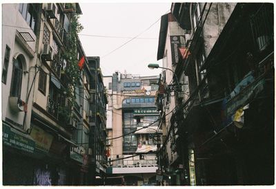 Buildings in city against sky