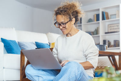 Young man using laptop at home